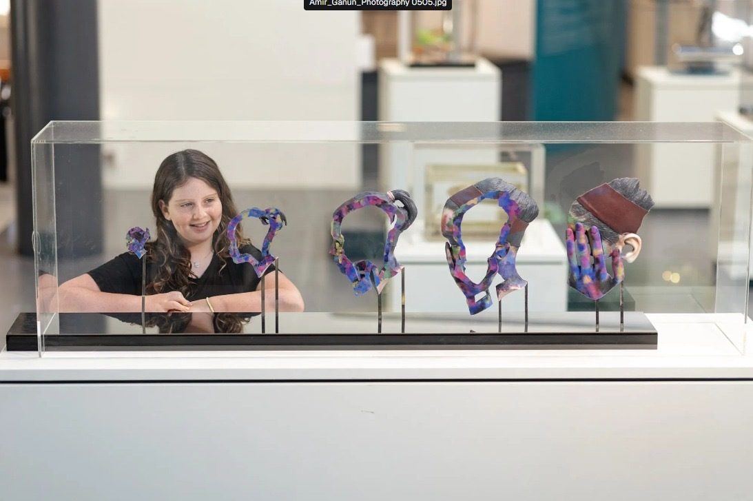 Visitors interacting with the exhibition — photograph 1