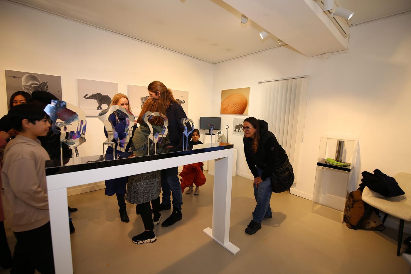 Visitors interacting with the exhibition — photograph 16